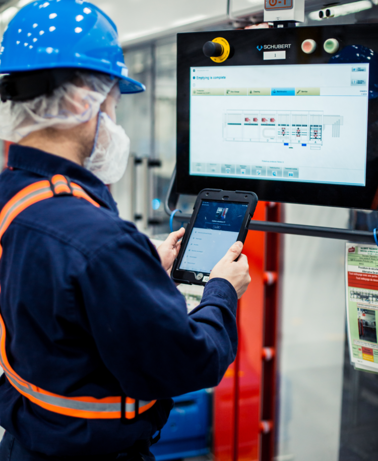 factory worker with ipad analysing oee